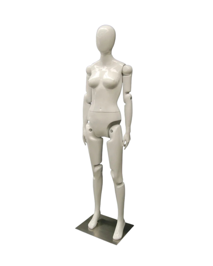 White fiberglass posable female mannequin with articulated joints and egghead design for display and fashion fitting.