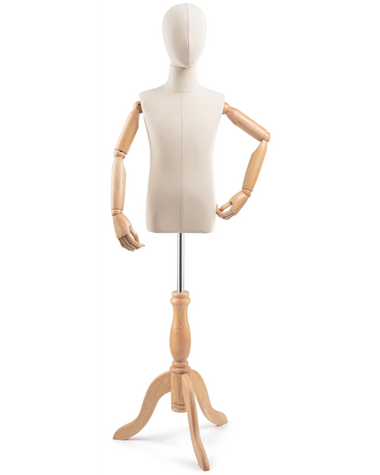 Posable child dress form with wooden tripod base and articulated arms, used for displaying children's clothing.