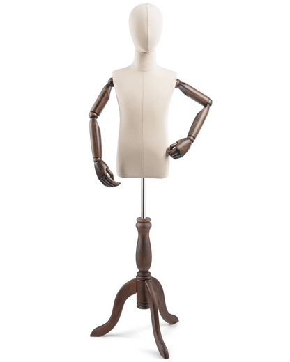 Child display dress form with wooden tripod base and articulated arms, used as a posable mannequin for clothing display.