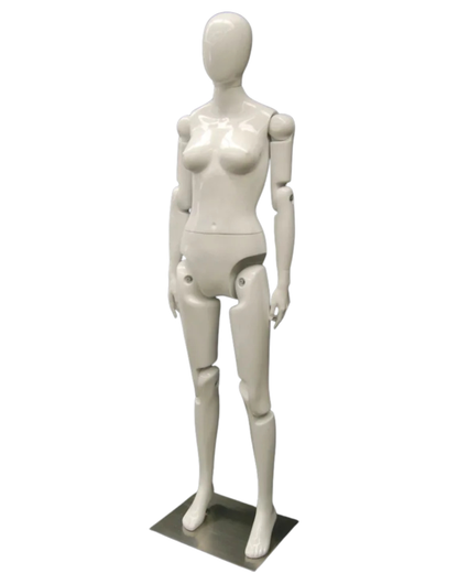 Posable female mannequin in white fiberglass with articulated joints and egghead design for art display and fashion fitting.