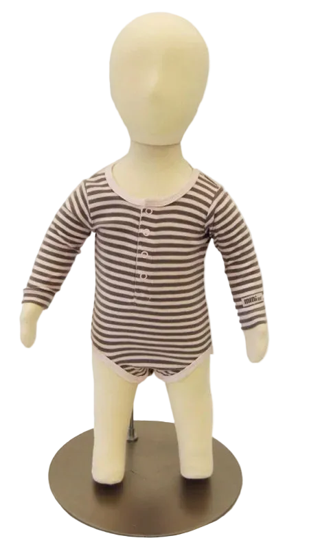 6-month old child mannequin displaying infant apparel in retail setting