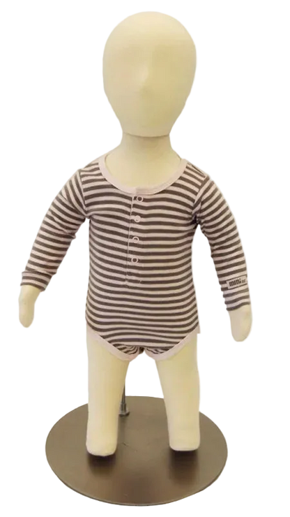 6-month old child mannequin displaying infant apparel in retail setting