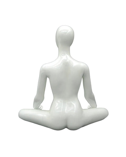 White female yoga mannequin in OM meditation pose, posable display model for yoga and meditation product presentation.