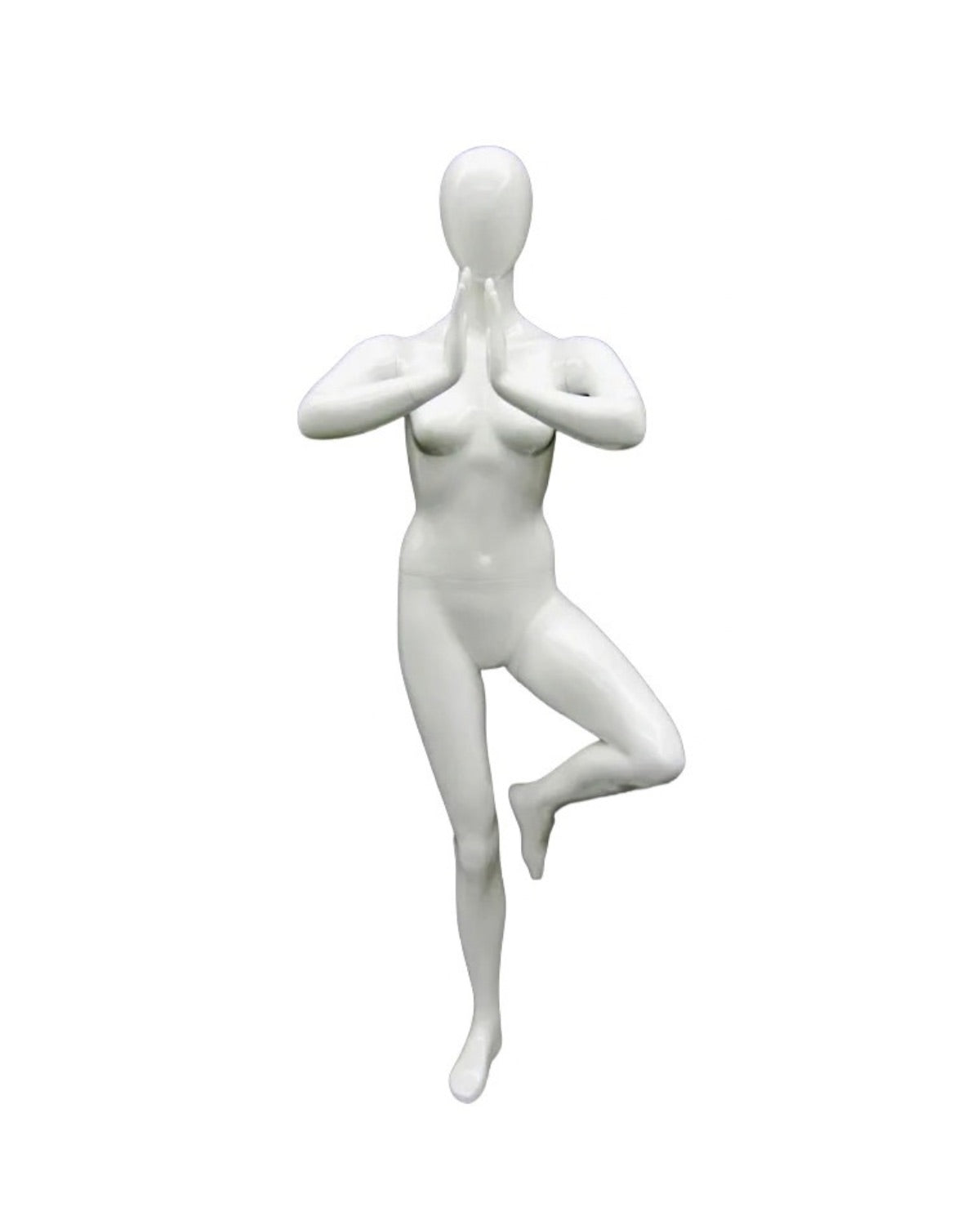 Posable female mannequin in white performing Tree Pose, used for yoga display by Roxy Display.