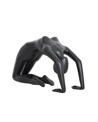 Posable female yoga mannequin in pigeon pose by Roxy Display showcasing flexibility and realistic pose for display or photography.