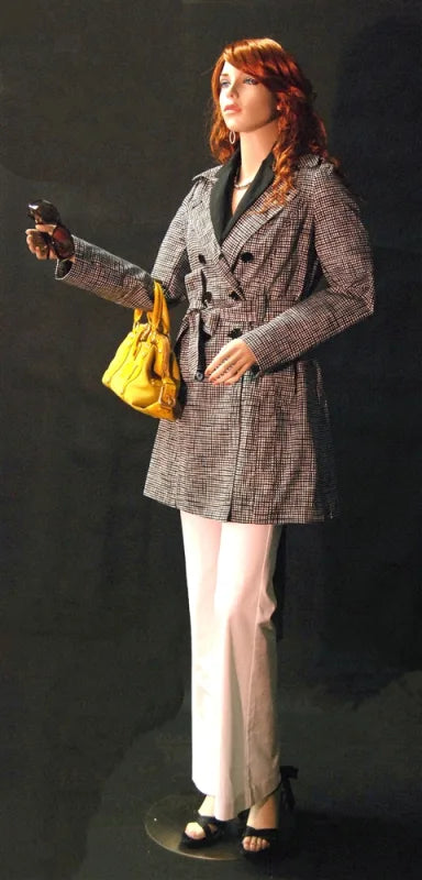 mannequin styled with coat and handbag retail display