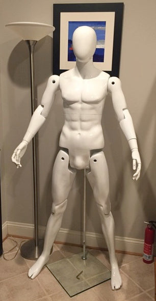 Glossy white fiberglass male mannequin with flexible joints, 5'10" posable display for retail and fashion store displays.
